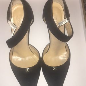 Black suede Chanel pumps
